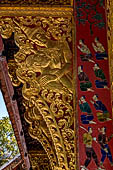 Wat Xieng Thong temple in Luang Prabang, Laos. the Ho Tai, the library. Detail of the console of the roof. 